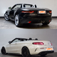 Both look good but the lines of that Jag are breathtaking.